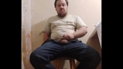A fat gay man sat down on a chair to masturbate his little cock